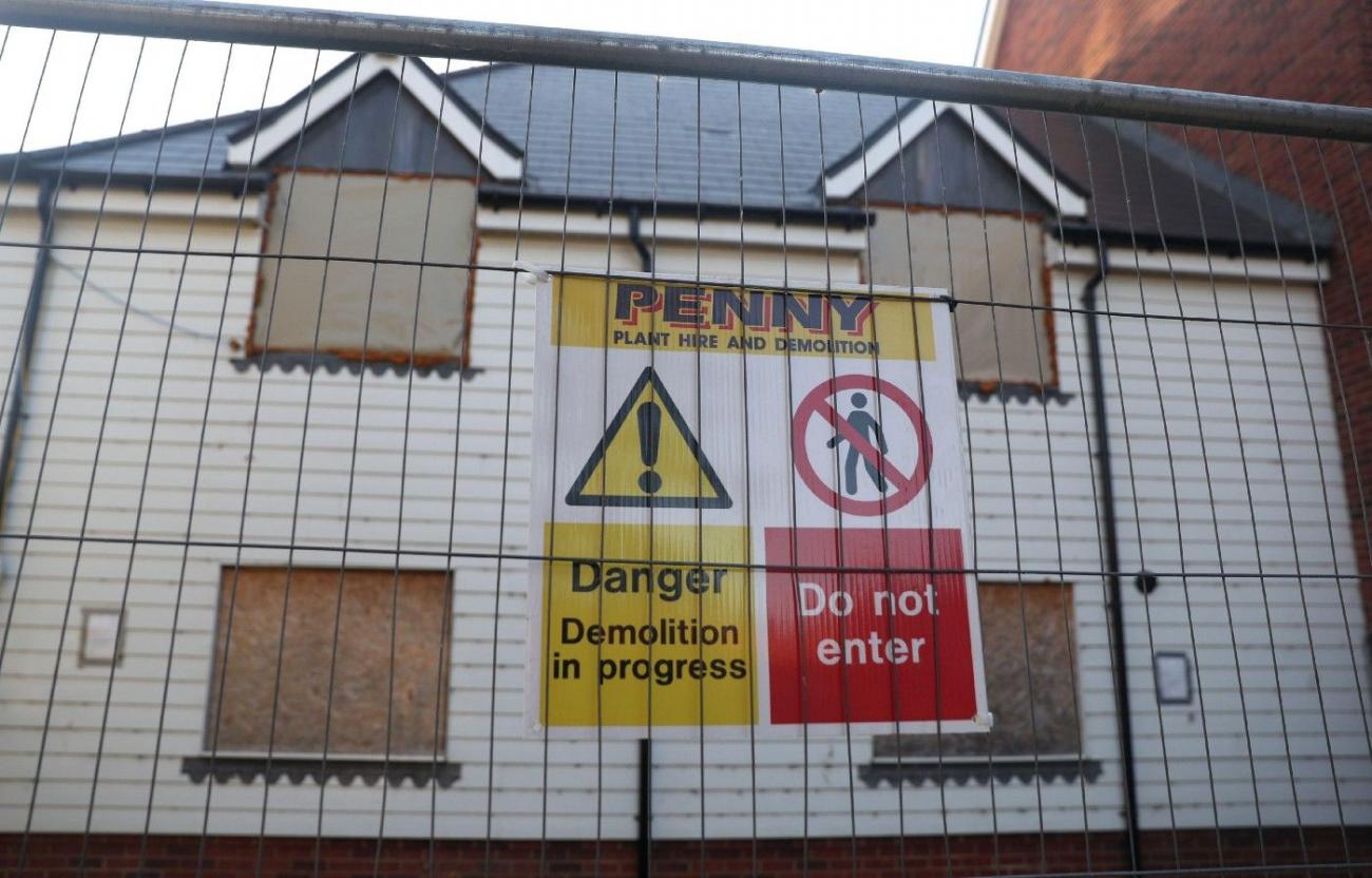 The building on Muggleton Road, Amesbury that housed the flat where Rowley and Sturgess were poisoned is prepared for demolition, 26 October 2020. Picture: PA Images/Alamy Stock Photo
