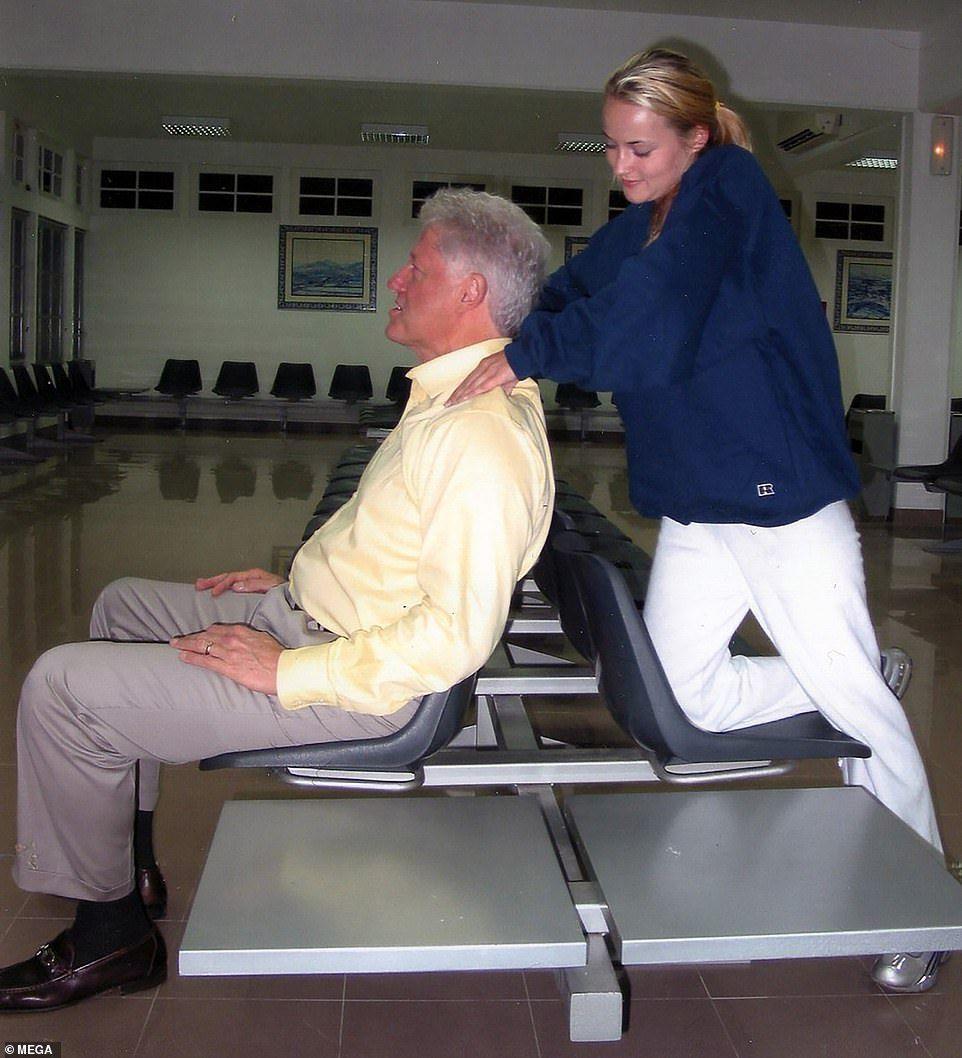Bill Clinton is seen enjoying a neck massage from a Jeffrey Epstein victim, Chauntae Davies, then 22 years old, in a stop-over in Portugal on the way to Africa in 2002