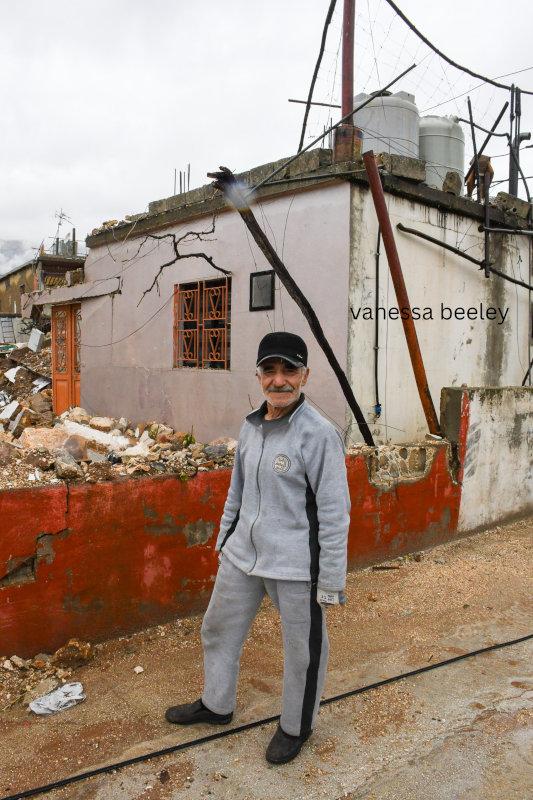 An old man standing in front of his sister's house. Photo: Vanessa Beeley