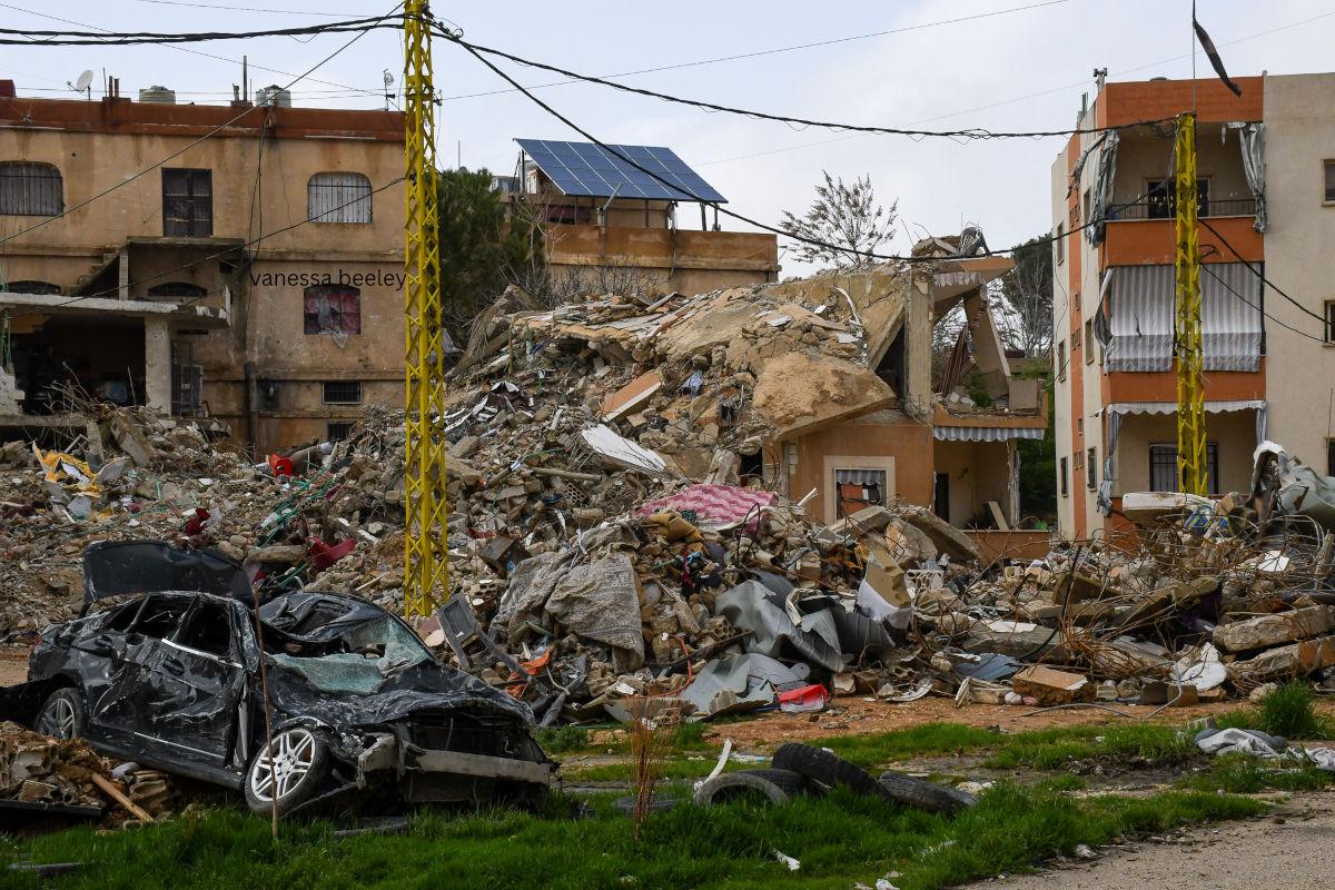 destroyed homes with car