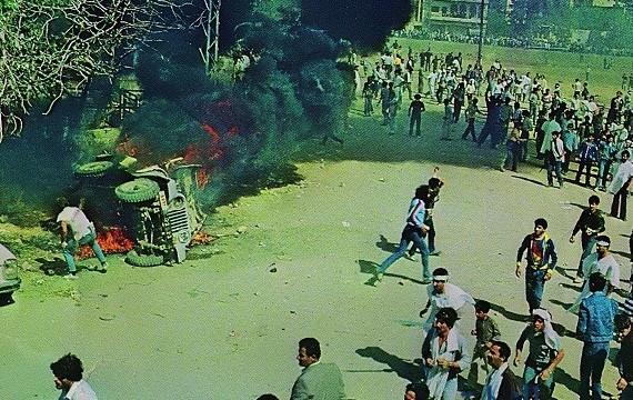 Lebanese citizens burn Israeli military vehicles during Ashura in Nabatieh, 1983