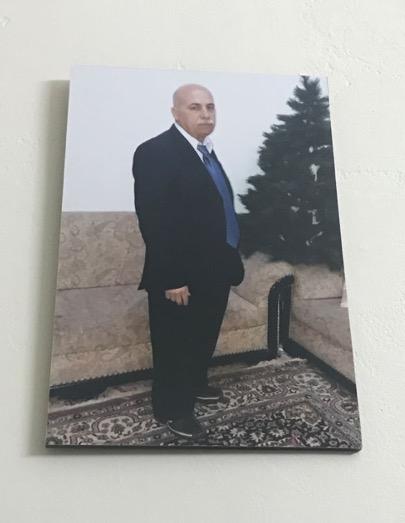 Photo of 62-year-old Anwar Nahas hanging on the wall of his house. (Photo: Vanessa Beeley)