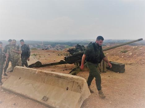 The artillery team prepare to fire a missile into Jaish Al Izza-controlled territory in Idlib. (Photo: Vanessa Beeley)