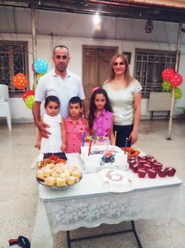 Shadi with his family celebrating Fadi’s sixth birthday two days before they were all martyred by the terrorist attack. (Photo: Shadi’s Facebook page)